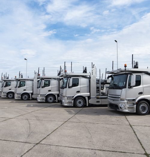 Group of trucks parked in line at truck stop. Group of trucks parked in line at truck stop.