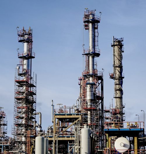 Modern factory in an industrial zone under a blue sky – a cool picture for presentations A modern factory in an industrial zone under a blue sky - a cool picture for presentations